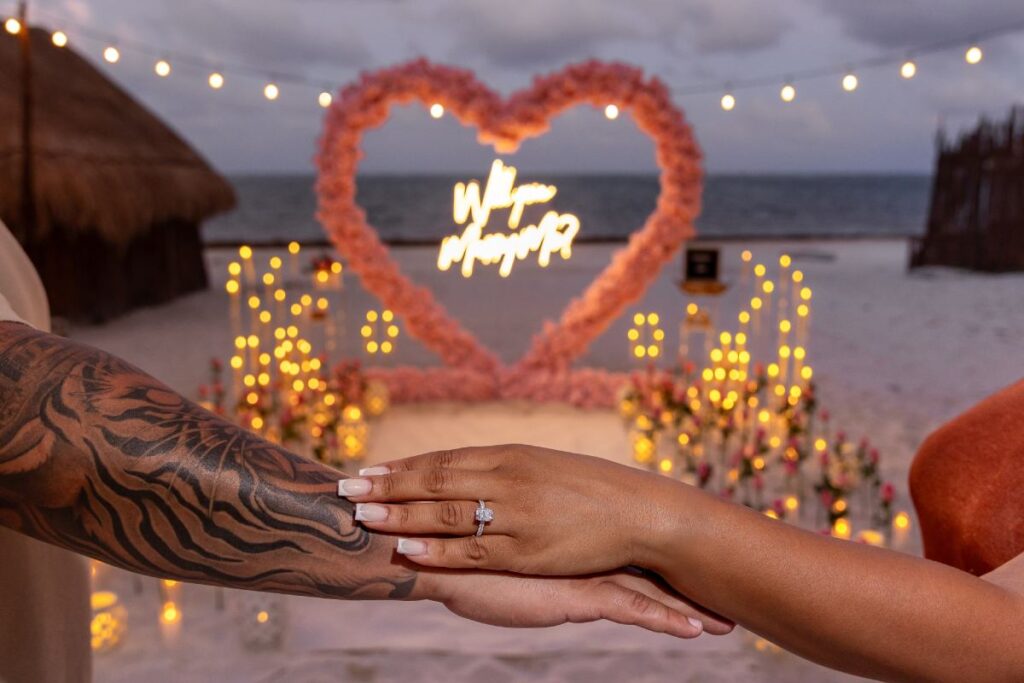 Romantic beach marriage proposal setup in Mexico at sunset