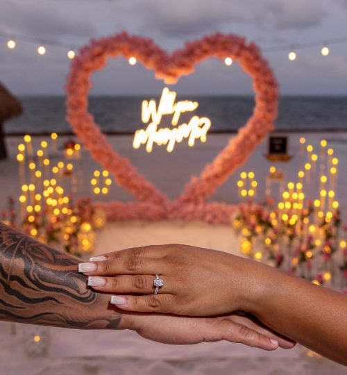 Romantic beach marriage proposal setup in Mexico at sunset