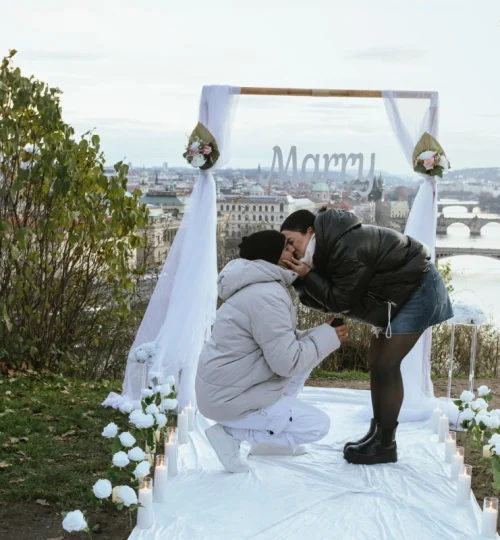 Luxury rooftop marriage proposal setup overlooking Prague at sunset